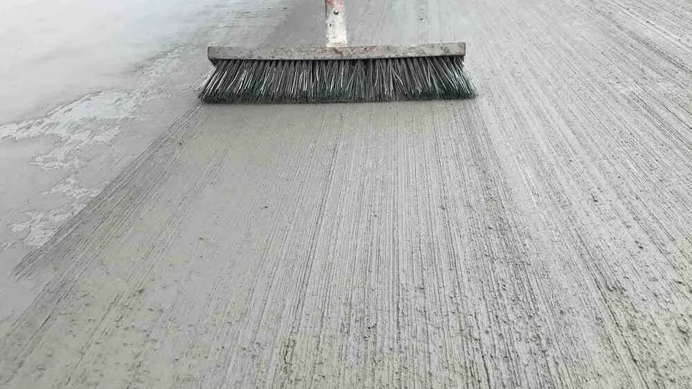 Concrete broom finishing tool
